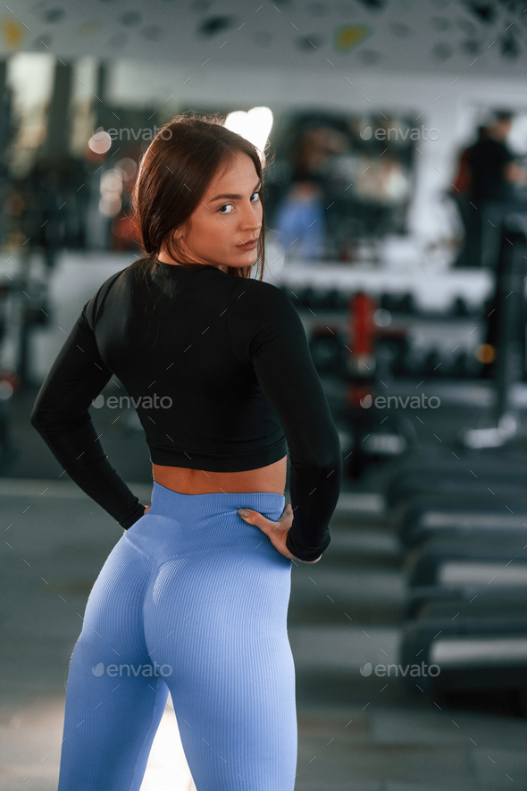 Side View. Woman in Sportive Clothes with Slim Body Type is in the