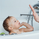 Kid taking bath, child bathing in bathtub, little baby playing with water - PhotoDune Item for Sale