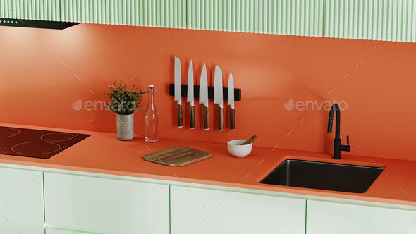 Kitchen countertop in bright orange and green colours with knives, stove and sink, decoration - Stock Photo - Images