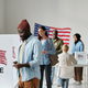 Group of young multicultural voters standing in queue in polling place - PhotoDune Item for Sale