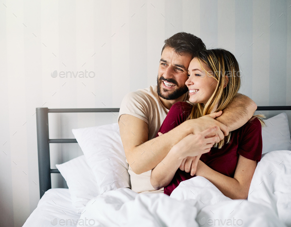 couple love bedroom bed lying romance happy relationship valentine day ...