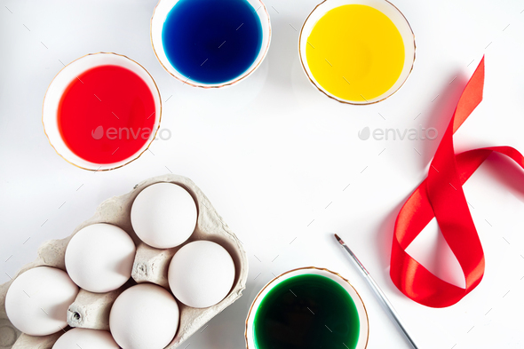 The process of preparing for painting eggs for Easter on a white background. - Stock Photo - Images