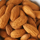 Close up picture of organic almonds in a bowl, selective focus. - PhotoDune Item for Sale