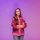 A woman poses on a purple background with her arms crossed. - PhotoDune Item for Sale