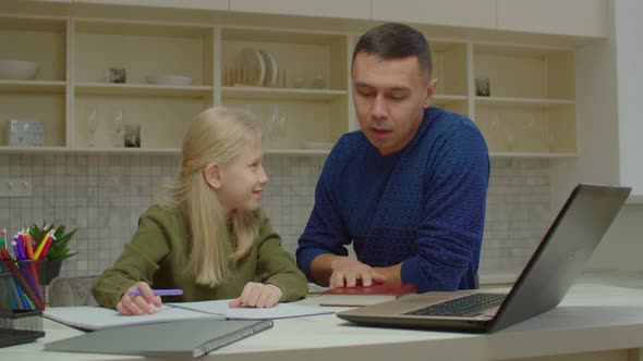 Loving Deaf Father Helping Cute Schoolgirl with Hearing Loss with Homework alt