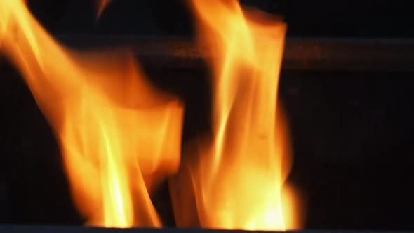 Blurry video footage of fire. Abstract burning flame and black background. represents the power