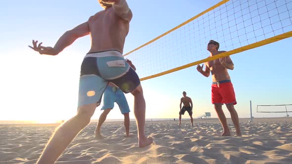 Men Playing Beach Volleyball By Goodsportvideo Videohive