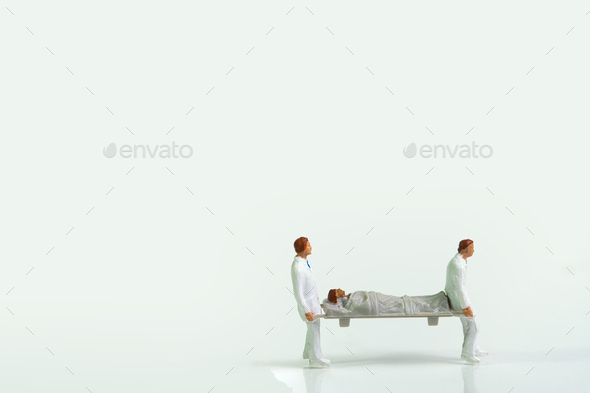 two male nurses with white coats carry a patient with a stretcher Stock ...