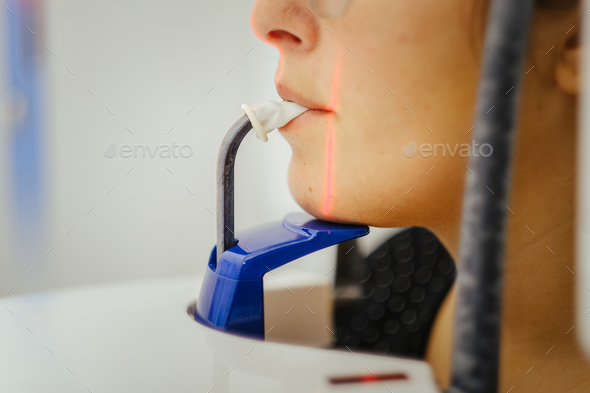 Closeup shot of a dental patient using panoramic radiography equipment