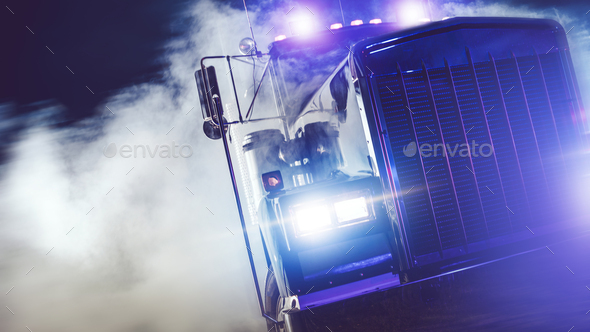 Semi Truck Drive Out of Smoke at Night - Stock Photo - Images