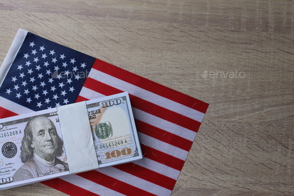 American flag and dollar cash money. Dollar banknote and United States flag background.