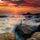 Sunset on the rocky shore of tropical sea - PhotoDune Item for Sale