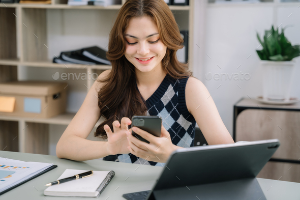 woman using mobile phone to chat with friends during free time.
