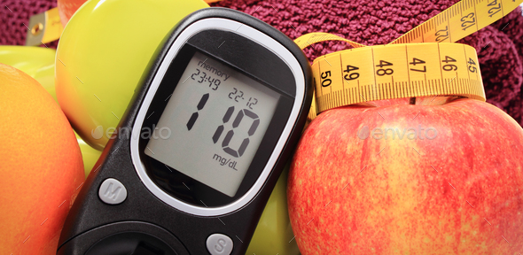Glucometer for checking sugar level, fresh fruits and dumbbells using in fitness - Stock Photo - Images
