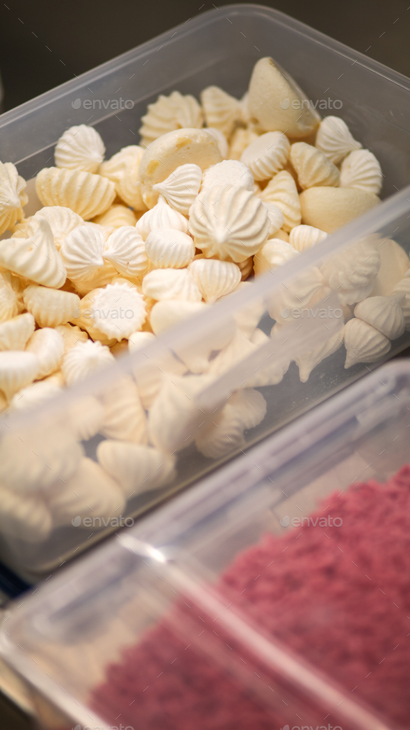 bunch of meringue twirls in a box for cake icing and top decoration