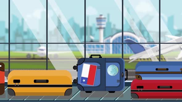 Luggage with Chilean Flag Stickers on Baggage Carousel alt