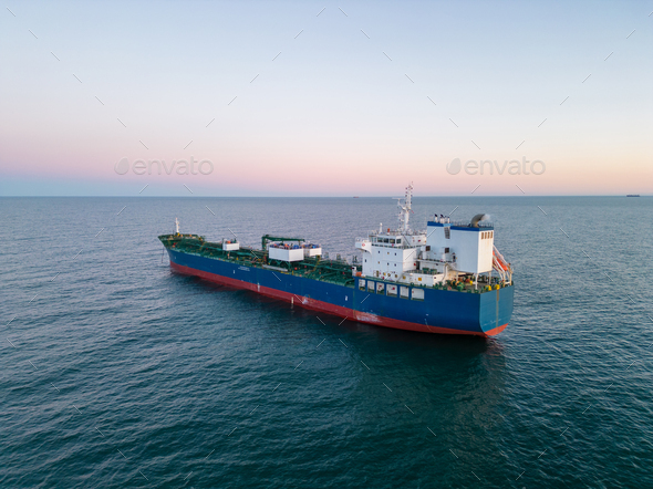 Aerial view oil ship tanker carrier oil on the sea at sunset