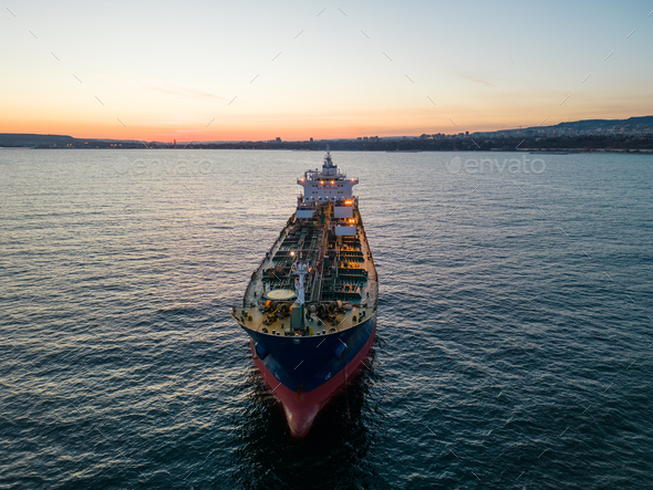 Aerial view oil ship tanker carrier oil on the sea at sunset