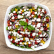 Vegetable salad on a white plate consisting of vegetables, cheese and balsamic dressing. - PhotoDune Item for Sale