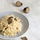 Risotto with porcini mushrooms and black truffles served in a plate top view, gourmet cousine - PhotoDune Item for Sale