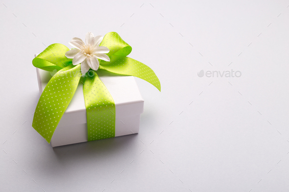 White gift box with green ribbon - Stock Photo - Images