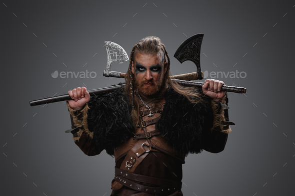 Antique Viking With Two Axes And Deerskin Against Grey Background Stock 