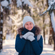 Happy Asian woman walking in winter snow forest. - PhotoDune Item for Sale