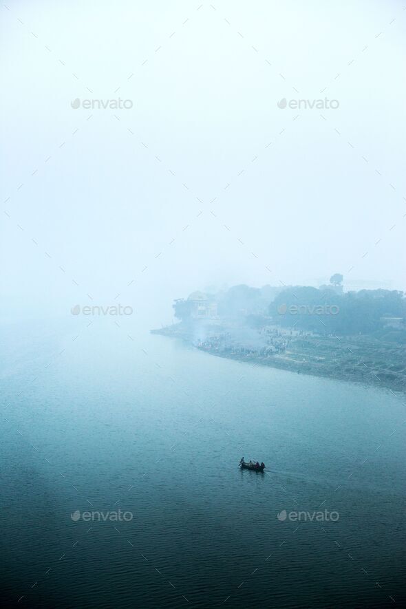 Fishing boat in the middle of the sea during early morning