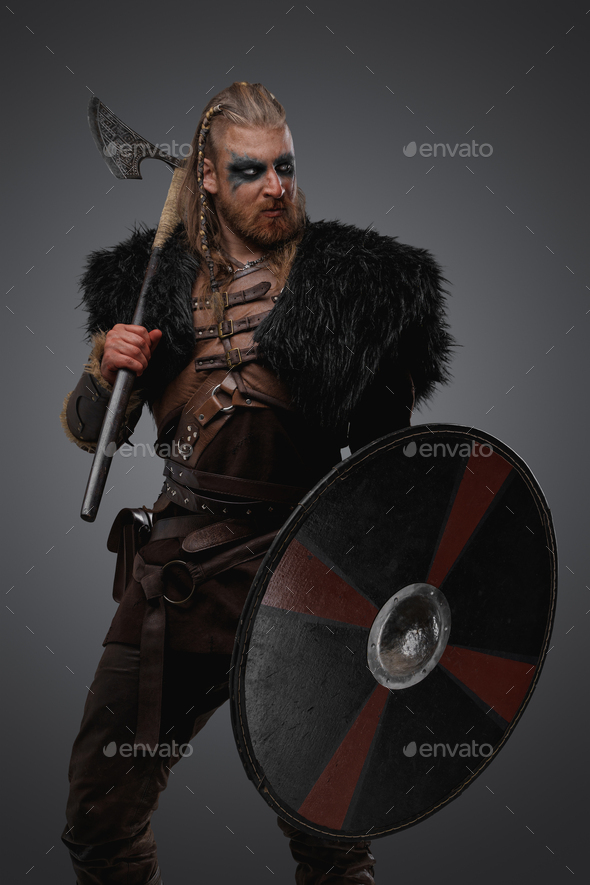 Aggressive scandinavian barbarian from past with shield and axe Stock ...