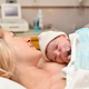Mom and newborn baby skin to the skin after birth in the hospital - PhotoDune Item for Sale