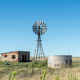 Abandoned farm worker house, windmill and dam - PhotoDune Item for Sale