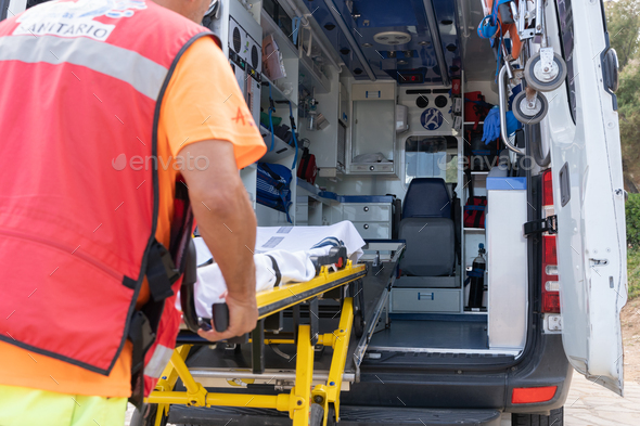 Unrecognizable Lifeguard worker working on an ambulance - Stock Photo - Images
