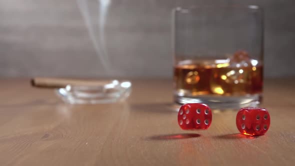 Dice and Glass of Whiskey and Smoke from Cigar
