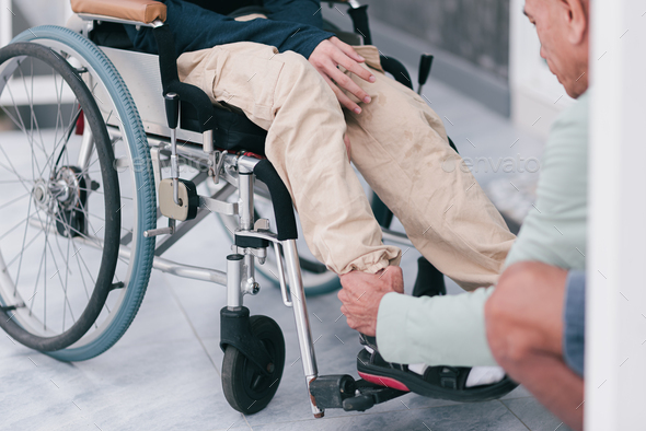 Concept of Family Caregiving in everyday life for happy teenage boy with disability on wheelchair. - Stock Photo - Images