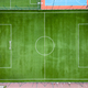 aerial view of a lush green football field, which appears well-maintained and ideal for athletic - PhotoDune Item for Sale