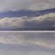 Stormy sky and reflections of clouds in shallow water of Salar de Uyuni - Altiplano, Bolivia - PhotoDune Item for Sale