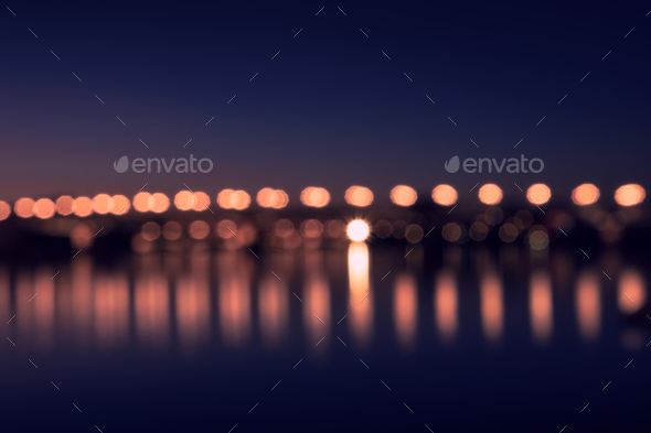 Background with blurred lights of lanterns at night. reflection of bokeh in river. Toulouse, France - Stock Photo - Images