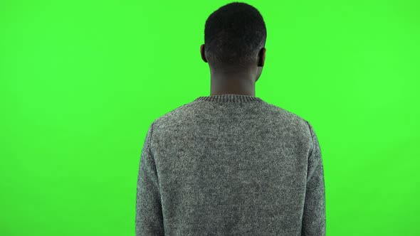 A Black Man Works on an Interactive Board - Green Screen Studio alt