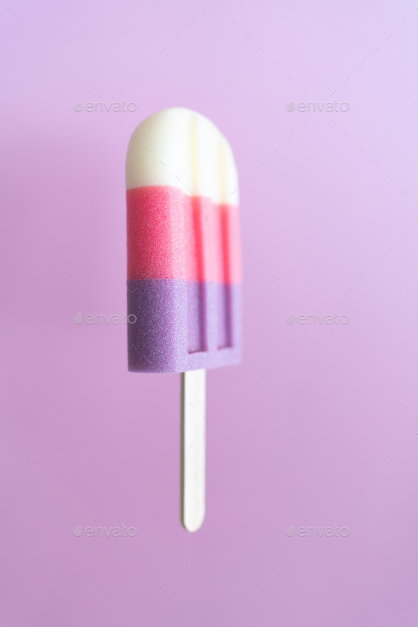 Colored ice cream popsicle on a pastel purple background. Minimal summer concept - Stock Photo - Images