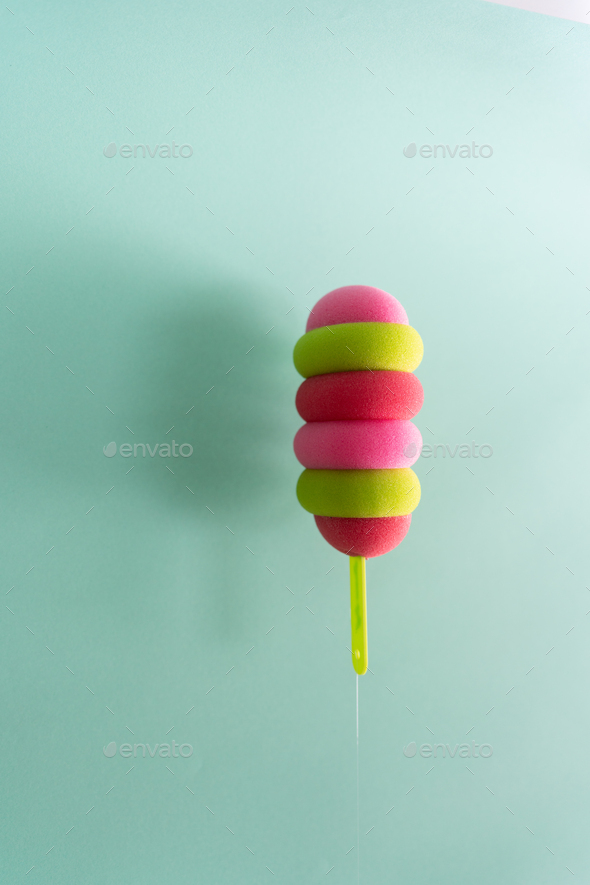 Colored ice cream popsicle on a pastel mint background. Minimal summer concept - Stock Photo - Images