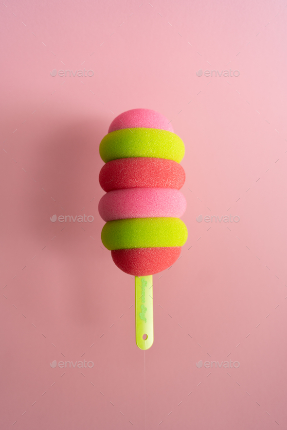 Colored ice cream popsicle on a pastel pink background. Minimal summer concept - Stock Photo - Images