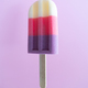 Colored ice cream popsicle on a pastel purple background. Minimal summer concept - PhotoDune Item for Sale
