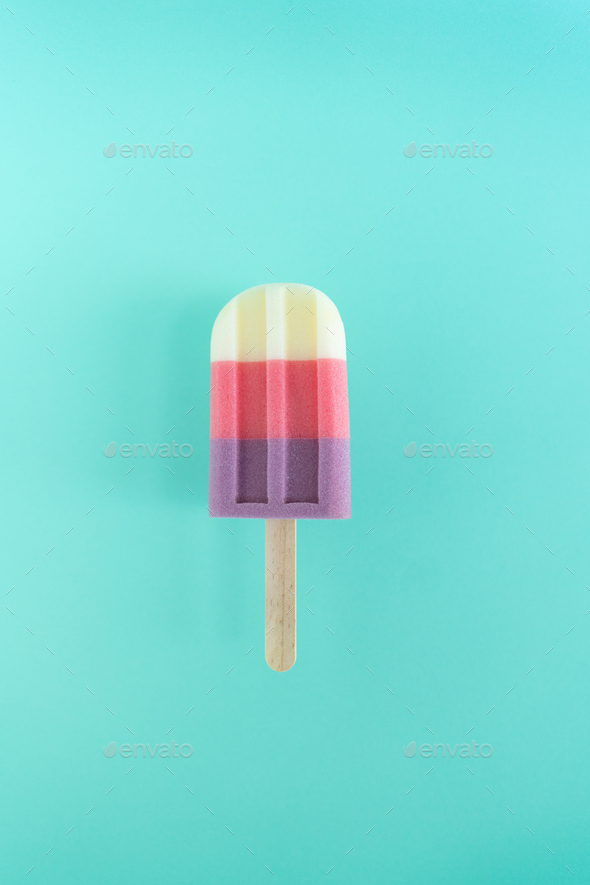 Colored ice cream popsicle on mint background. Minimal summer concept. - Stock Photo - Images