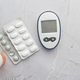 diabetic measurement tools and medical pills on table  - PhotoDune Item for Sale