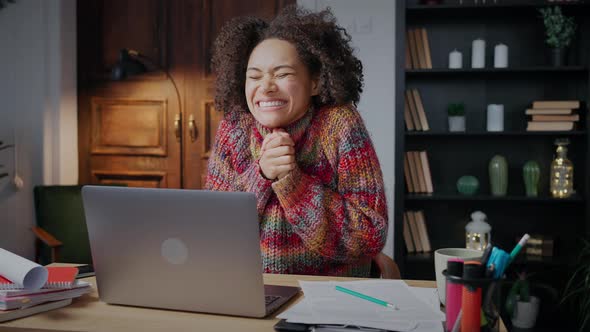 Young Happy African American Lady Reading Winning Email on Laptop Enjoying Her Victory Smiling alt