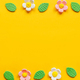 Stylish colorful flowers flat lay on yellow background - PhotoDune Item for Sale