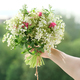 Beautiful fresh bouquet in woman hand. Floristry, work of florist - PhotoDune Item for Sale