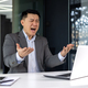 Angry boss working at work, senior experienced businessman in business suit shouting at computer - PhotoDune Item for Sale