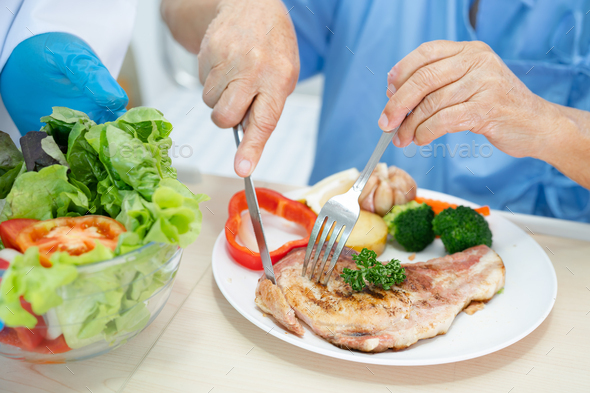 Asian seniorwoman patient eating breakfast and vegetable healthy food with hope and happy   - Stock Photo - Images