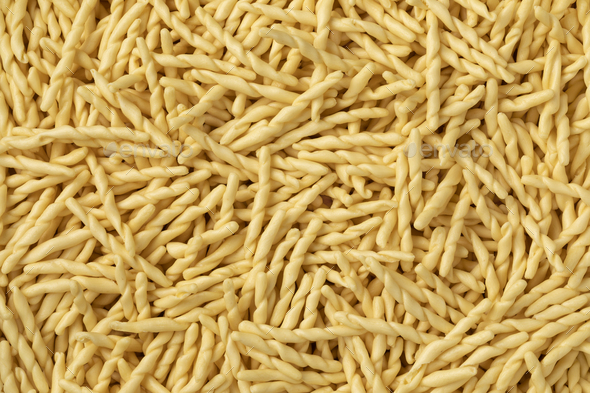 Dried Italian trofie pasta close up full frame - Stock Photo - Images